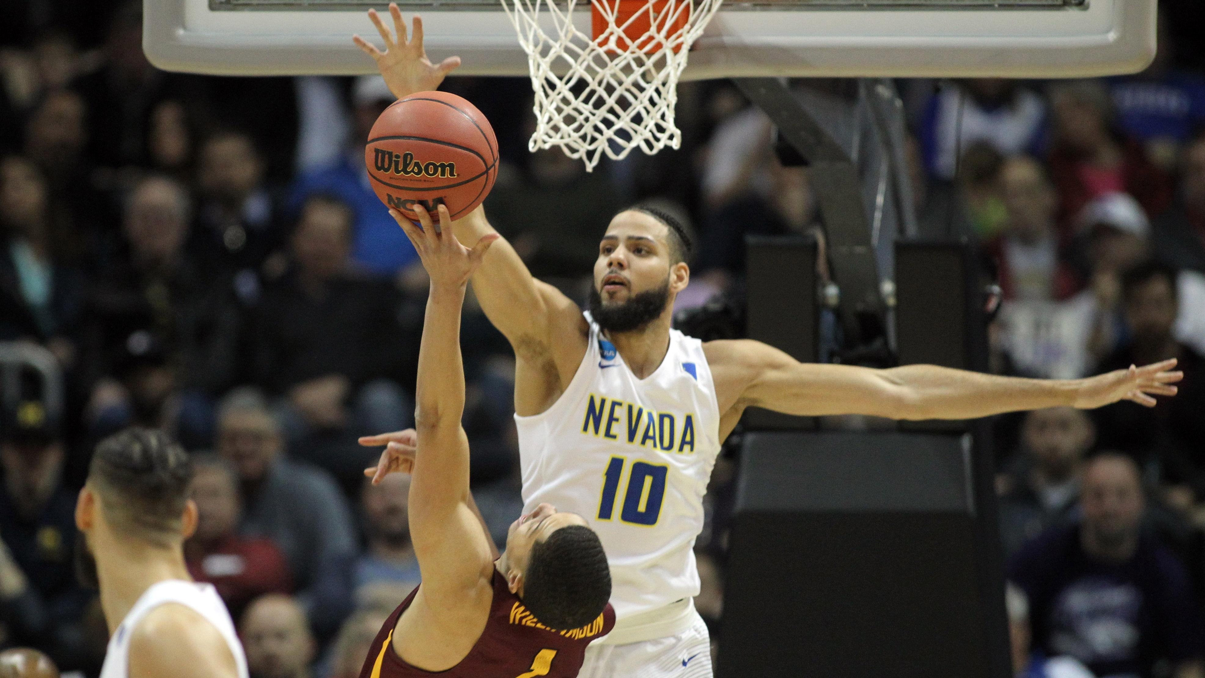 Nevada's Caleb Martin blocks a shot