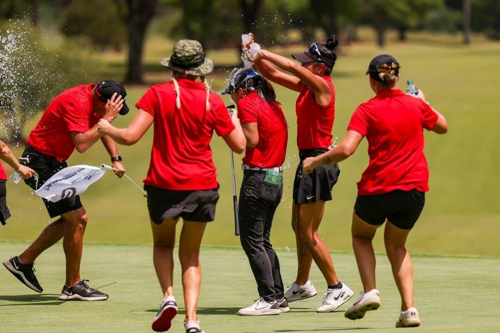 Georgia's women's golf team celebrates on the course after winning the Athens regional