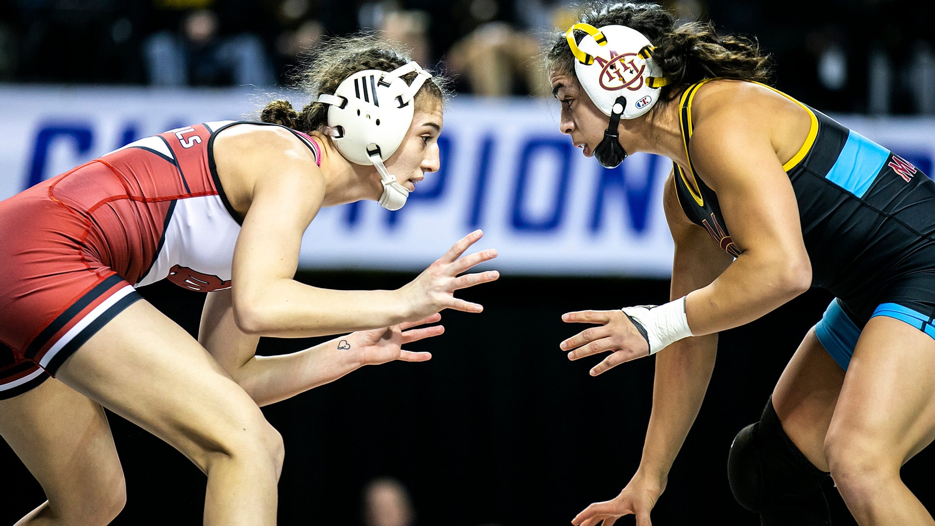 Amani Jones (left) of North Central (Illinois) wrestles Colorado Mesa’s Marissa Gallegos